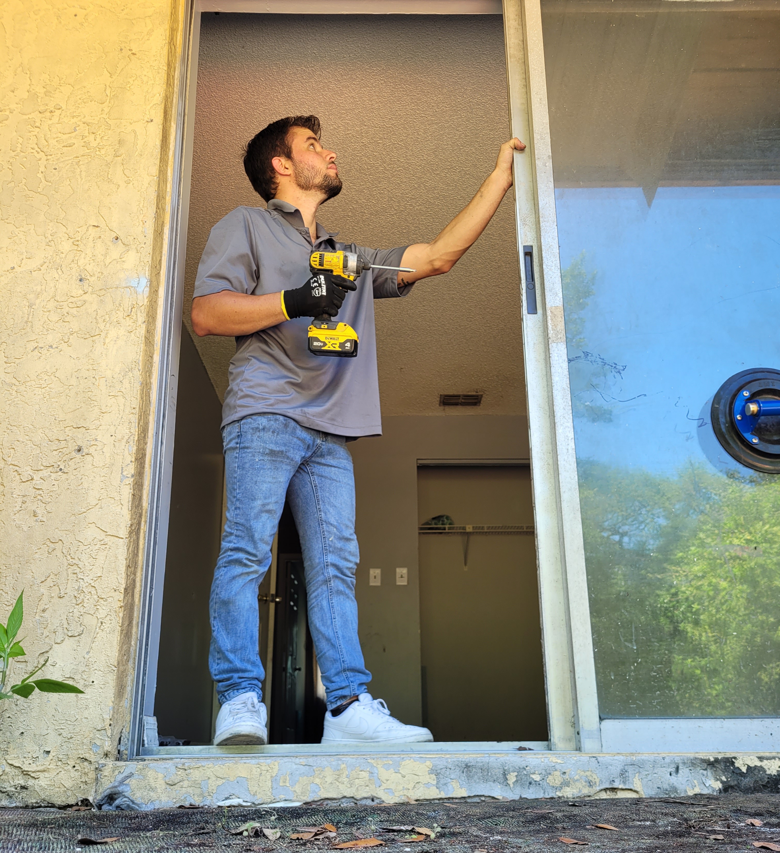 Alonso working on sliding door repair in Metro Detroit — Michigan Sliding Doors View Experts